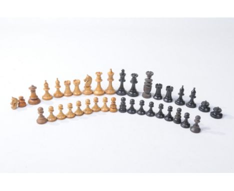 A composite Staunton type wooden chess set 
Comprising twenty-nine individual pieces, the light wooden pieces comprising King