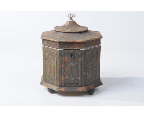 An early to mid 19th Century tortoiseshell tea caddy 
Of architectural form, the eight sided vessel, applied with carved pane