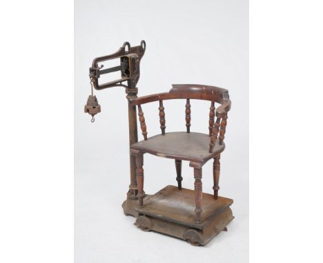 A rare W T Avery cast iron and mahogany Jockey Scales
Late 19th Century with a circular column with a scale in pounds, a nest