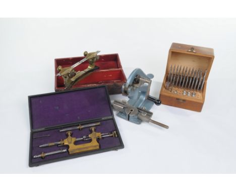 Watch and Clock makers tools, a French cased watch makers pivoting gauge
The gilt metal instrument stamped Swiss in original 