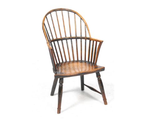 A Victorian ash and elm stick back Windsor elbow chair
With a comb back, incurved front arm supports, the shaped elm saddle s