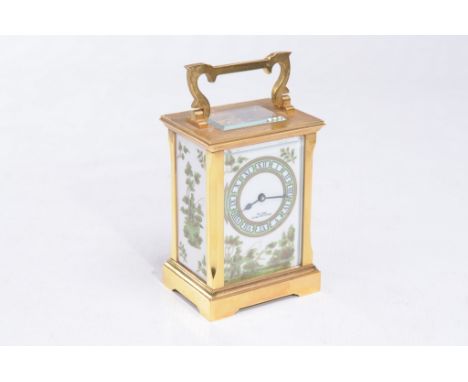An English brass cased carriage timepiece
With a 6cm porcelain dial signed The Chester Carriage Clock Company with Roman nume