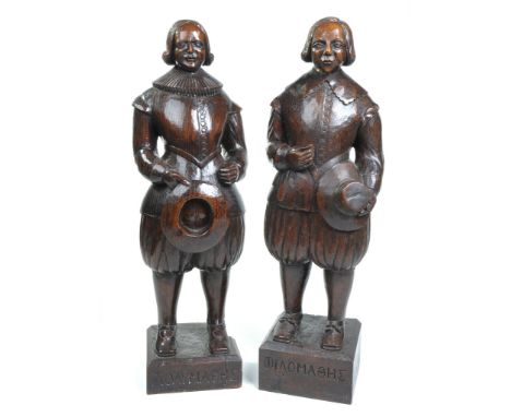 An interesting pair of carved oak figural terms, 17th Century style
Each rendered in full length, the first carved with a cle