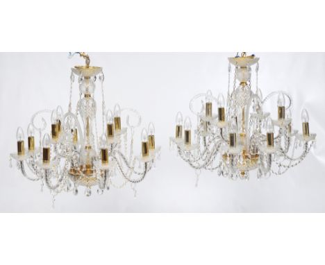 A choice pair of twelve branch glass chandeliers
Each with petal shape tops rising from a baluster shaft the domed base with 
