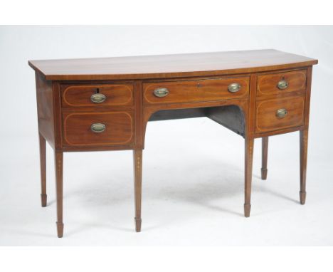 A George IV and later inlaid mahogany bow front sideboard
With a cross banded and inlaid top above a frieze drawer flanked by