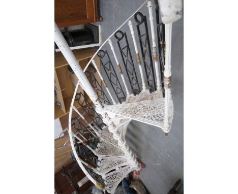 A Safety Stairways Ltd cast iron Spiel staircase
With ten triangular steps with scrolling infills with fluted baluster column
