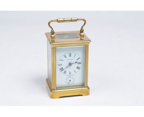 A French carriage clock
With a 5cm white enamel dial signed Mappin & Webb with Roman numerals and subsidiary alarm dial with 