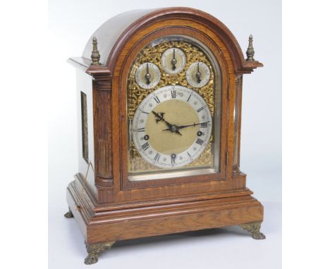 A good oak and gilt brass bracket clock
With a 16cm silvered chapter ring with Roman and Arabic numerals with slow fast chime