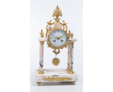 A French variegated marble and gilt metal portico mantle clock
With a 9.5cm white enamel dial with Arabic numerals painted wi