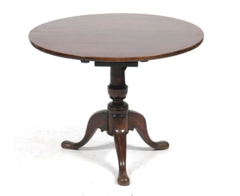 A 19th Century and later mahogany tripod table
With an 86cm diameter top raised upon a vase shape shaft and triform downswept