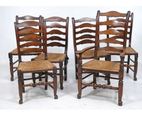 A Harlequin set of six ash ladder back chairs
19th Century including an open arm chair each with graduated shaped arched spla