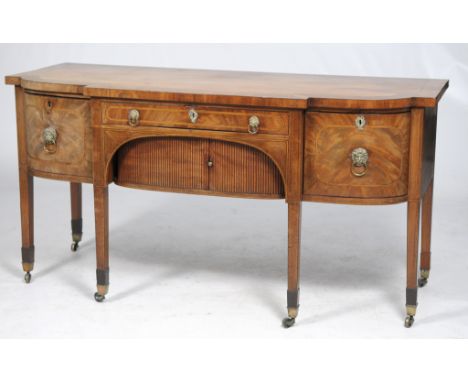 An early 19th Century inlaid mahogany breakfront sideboard
With a wide crossbanded border with ebony line inlay above a friez