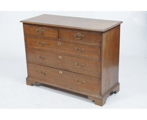 A late 18th Century oak chest of drawers
The rectangular moulded top above two short and three long graduated cock beaded dra