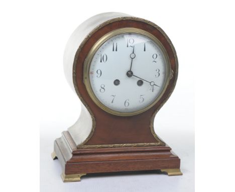 A French gilt metal mounted mahogany balloon clock, circa 1900
With a 13cm convex white enamel dial with Arabic numerals with