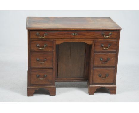 A 19th Century and later mahogany pedestal writing desk
The rectangular moulded top above a cockbeaded frieze drawer each ped