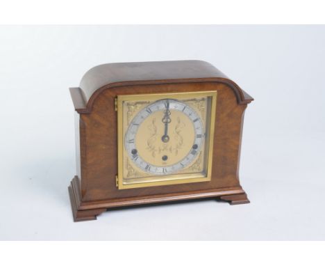 A walnut cased three train mantle clock, 20th Century
With a 14cm gilt dial signed Elliott, London with a silver chapter ring