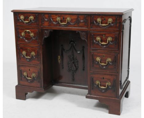 A choice 19th Century mahogany pedestal dressing table
The rectangular moulded top above a frieze drawer applied with festoon