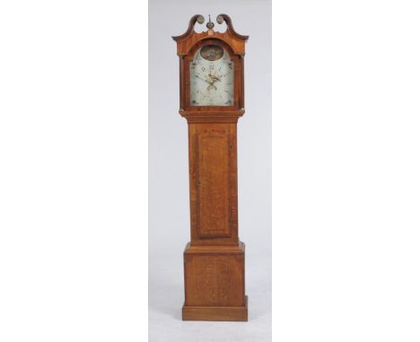 An early 19th Century oak and mahogany inlaid longcase clock
With a 30cm white arched dial signed Wainwright, Nottingham with