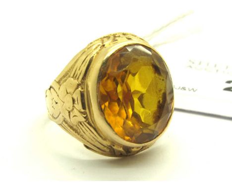 A Single Stone College Style Ring, oval collet set to centre, between foliate inspired tapered shoulders, stamped "18K" (fing