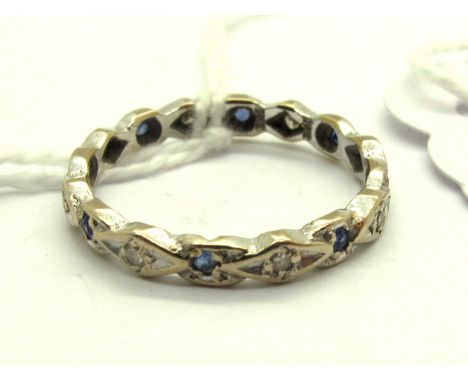 A Dainty Full Eternity Style Ring, alternate stone set, indistinctly stamped "18"(?) (finger size O 1/2) (2grams).