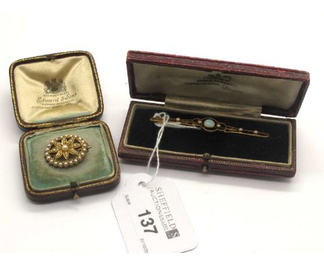An Edwardian Opal and Seed Pearl Bar Brooch, of sinuous openwork design, circular collet set to centre, stamped "15ct"; A Edw