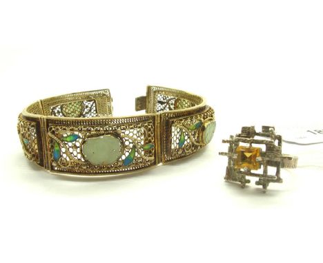 A 1970's Modernist Hallmarked Silver Single Stone Dress Ring, square set to the centre (chipped), within geometric textured o