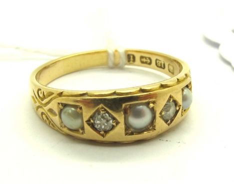 A Victorian 18ct Gold Diamond and Pearl Set Ring, the brilliant cut diamonds circular collet set between graduated pearls, be