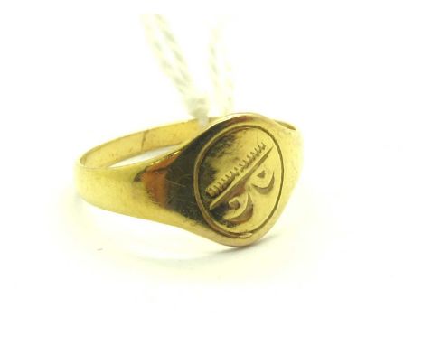 A Child's Signet Style Ring, the oval panel with engraved decoration, stamped "375" (finger size D).