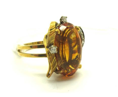 An Abstract Nature Inspired Diamond and Stone Set Dress Ring, the faceted oval centre stone, between diamond set decoration, 