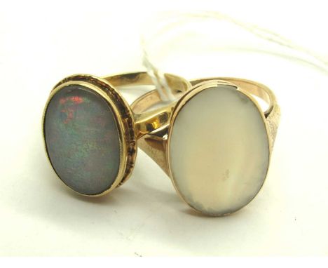 A Victorian 9ct Gold Opal Ring, oval collet set to centre with reeded decoration to border, between uniform band (finger size