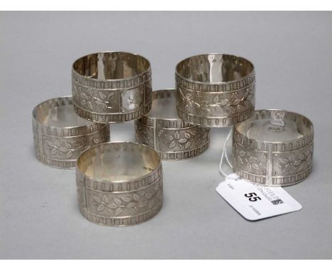 Charles Horner; A Set of Six Hallmarked Silver Napkin Rings, Chester 1944, of textured floral decoration, engine turned to ed