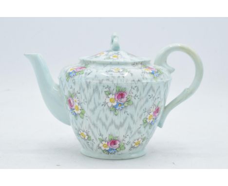 Paragon Fine China teapot with floral decoration on a light blue / duck egg green background. In good condition with no obvio