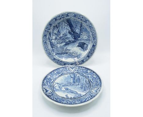 A pair of Delfts blue and white wall chargers depicting country and hunting scenes. 'Made for Royal Sphinx by Boch Holland'. 