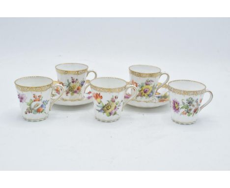 A collection of Dresden fine bone china to include a pair of cups and saucers together with 3 cups all decorated with floral 