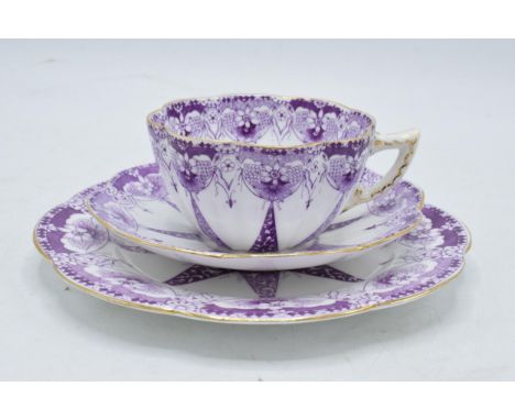Wileman and Co Foley china (pre Shelley) trio to consist of a shaped cup, saucer and side plate (3) with a purple design. In 