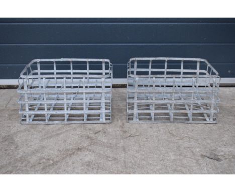 A pair of vintage metal stacking milk crates. Each to hold 16 bottles. Approx 44 x 35cm. 