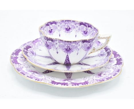 Wileman and Co Foley china (pre Shelley) trio to consist of a shaped cup, saucer and side plate (3) with a purple design. In 