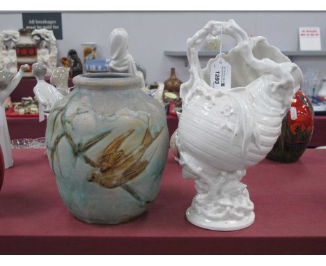 Bourne Denesby Ware Art Deco Vase, featuring bird, 20cm high together with a white ceramic shell basket vase.