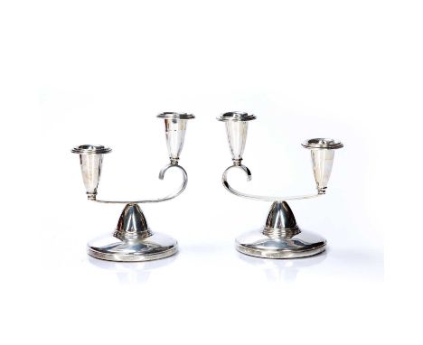 Pair of silver candelabra bearing marks for Atkin Brothers, Birmingham, 1959, 12cm high overall, with loaded bases (2)Conditi