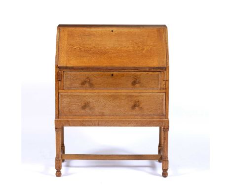 Heals limed oak bureau, a Heals button to the right hand side of the top drawer, 76cm x 102cm x 43cmCondition report: Fall fr