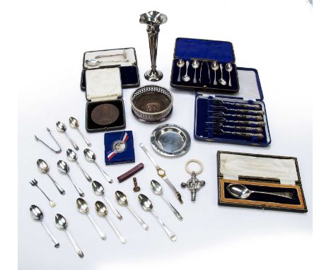 Selection of silver and silver-plated wareincluding: cake knife, spoons, cased silver handles cake forks, white metal pin dis