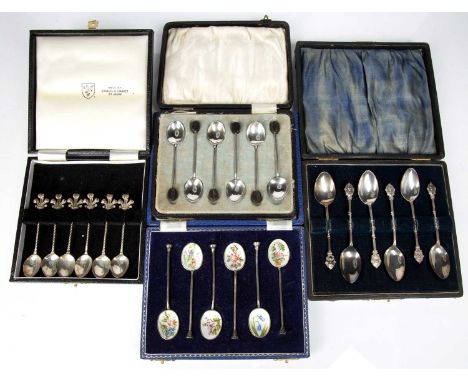 Four cased sets of silver spoonsconsisting of a set of six commemorative silver teaspoons with Prince of Wales plumes finial,