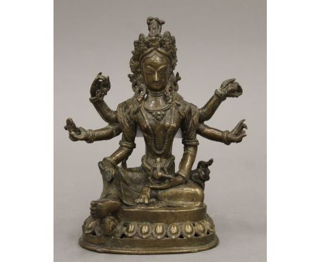 A small antique Tibetan six armed bronze figure of Buddha. 13.5 cm high.