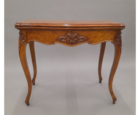 A Victorian burr walnut card table. 86 cm wide.