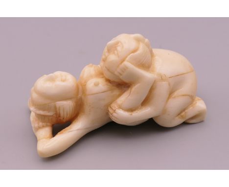 An erotic bone netsuke.  5 cm long. 