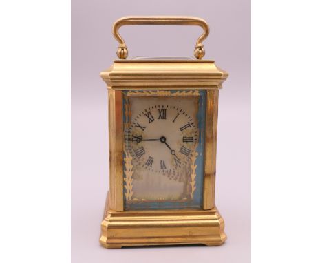 A Sevres style miniature carriage clock.  8 cm high. 