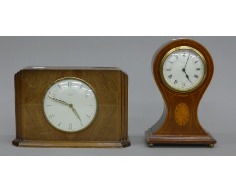An Edwardian inlaid mahogany mantle clock and a time saving clock. The former 23 cm high.