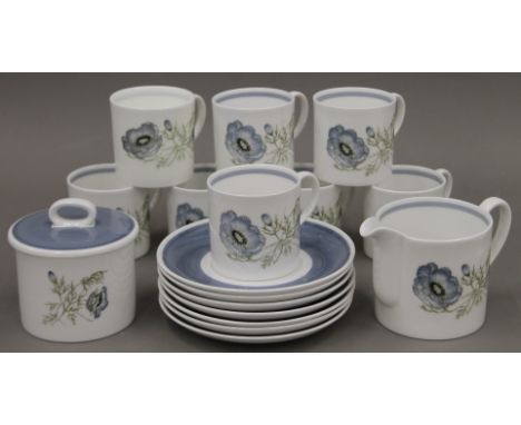 A set of Susie Cooper Glen Mist pattern porcelain coffee cups (8), saucers (7) and a sugar bowl.