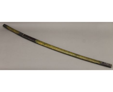 An Oriental sword in scabbard. 122.5 cm long.