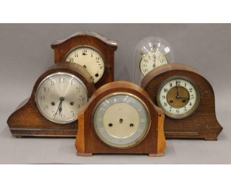 Four mantle clocks and an anniversary clock. 